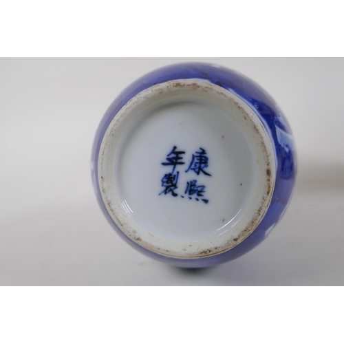 335 - A C19th Chinese blue and white bottle vase decorated with prunus blossom on a cracked ice ground, Ka... 