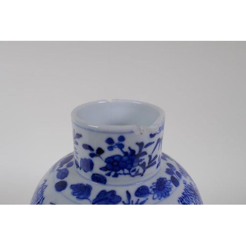 335 - A C19th Chinese blue and white bottle vase decorated with prunus blossom on a cracked ice ground, Ka... 