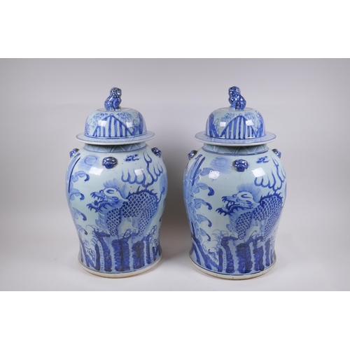 347 - A pair of Chinese blue and white porcelain jars and covers with lion mask, kylin and Fo-dog decorati... 