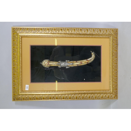 348 - An Arab Jambiya dagger, mounted in a gilt frame, 55 x 80cm