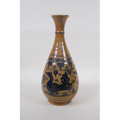 350 - A C19th oriental blue and white pottery pear shaped vase decorated with ducks and fish, 34cm high