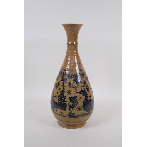 350 - A C19th oriental blue and white pottery pear shaped vase decorated with ducks and fish, 34cm high