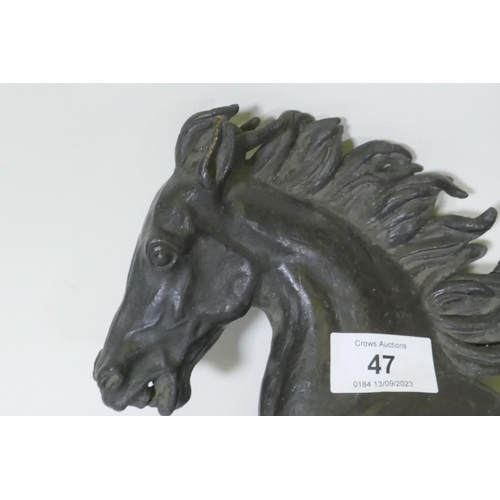 47 - A bronze figure of a galloping horse, unsigned, 40cm long