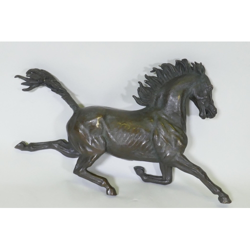 47 - A bronze figure of a galloping horse, unsigned, 40cm long