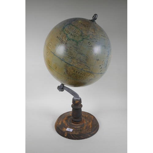 48 - A French terrestrial globe on wood stand, 70cm high