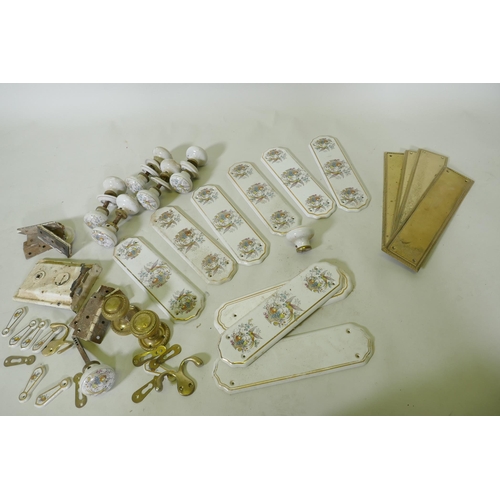 54 - A quantity of brass and porcelain door furniture, finger plates 28cm long