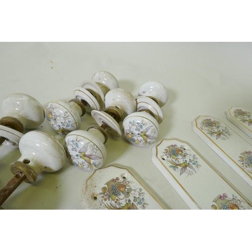 54 - A quantity of brass and porcelain door furniture, finger plates 28cm long