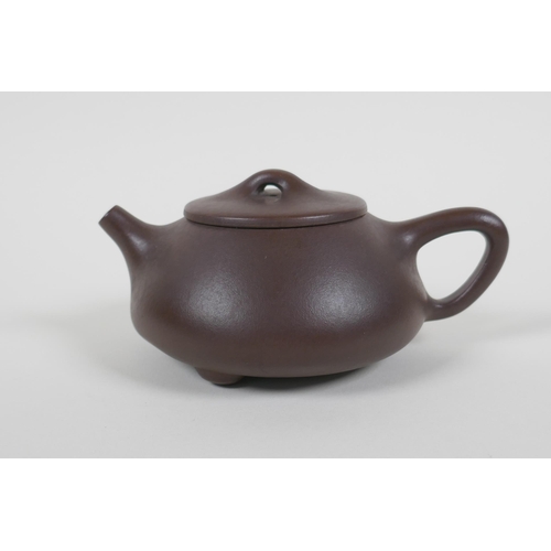 55 - A Chinese YiXing teapot, impressed marks to base, 10cm diameter