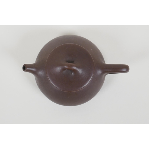 55 - A Chinese YiXing teapot, impressed marks to base, 10cm diameter