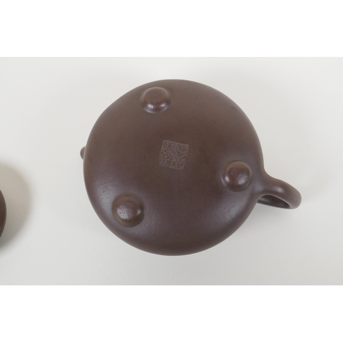 55 - A Chinese YiXing teapot, impressed marks to base, 10cm diameter