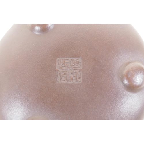 55 - A Chinese YiXing teapot, impressed marks to base, 10cm diameter