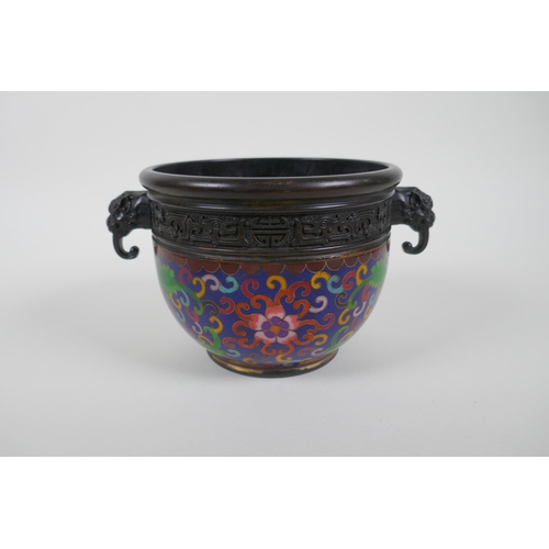 56 - A Chinese bronze pot with cloisonne lotus flower decoration and two dragon mask handles, seal mark t... 