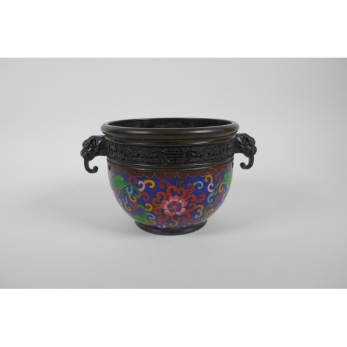 56 - A Chinese bronze pot with cloisonne lotus flower decoration and two dragon mask handles, seal mark t... 