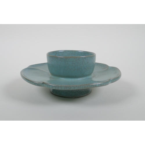 58 - A Chinese celadon crackle ware stand of flower petal form, chased character marks, 16cm diameter