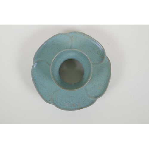 58 - A Chinese celadon crackle ware stand of flower petal form, chased character marks, 16cm diameter