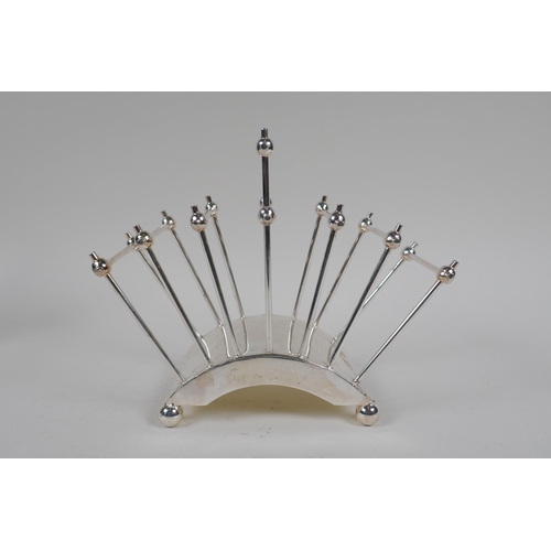 609 - A Christopher Dresser style silver plated letter rack, 18cm high x 21cm long