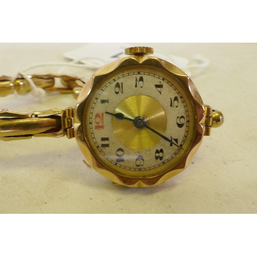 621 - A lady's 9ct gold wristwatch and strap, dial 2.5cm wide