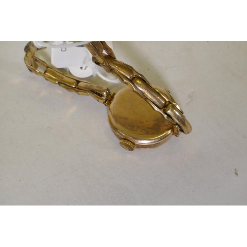 621 - A lady's 9ct gold wristwatch and strap, dial 2.5cm wide