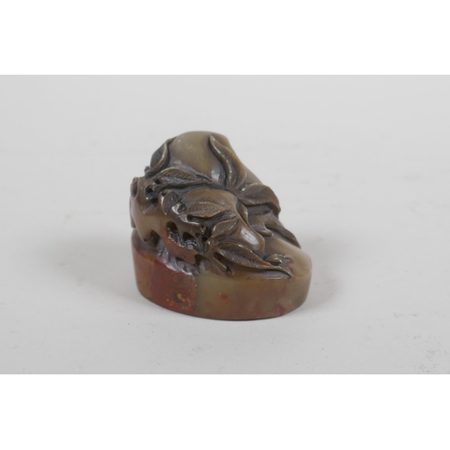 64 - A Chinese carved soapstone seal with peach decoration, 4.5cm high