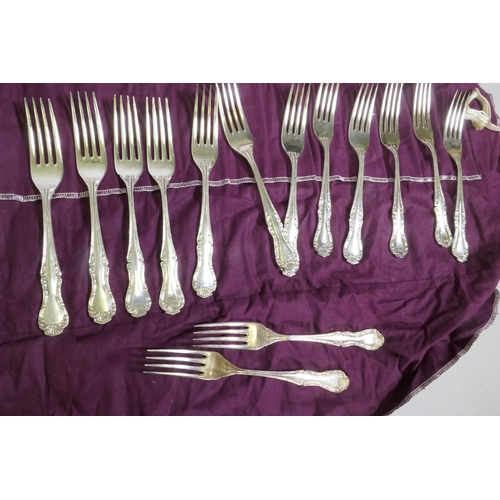 641 - A Mappin & Webb twelve place part cutlery service, a pair of toast racks with Royal cypher, Cohr... 