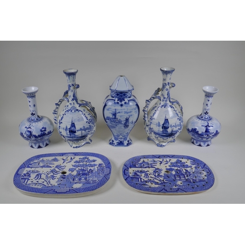 69 - A pair of Delft Royal Bonn porcelain vases with two handles, together with two Delft slender necked ... 