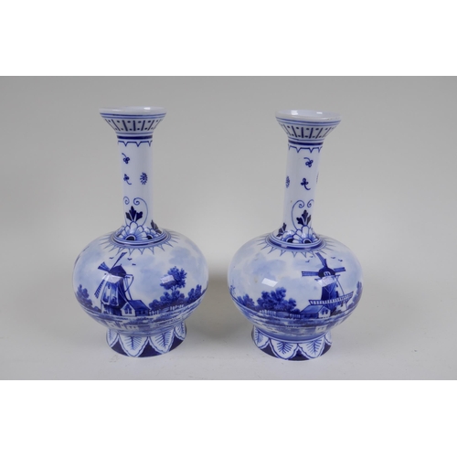 69 - A pair of Delft Royal Bonn porcelain vases with two handles, together with two Delft slender necked ... 