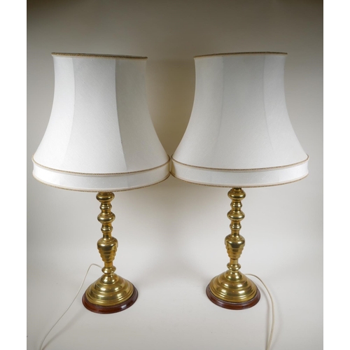 72 - A pair of spun brass table lamps, 57cm high