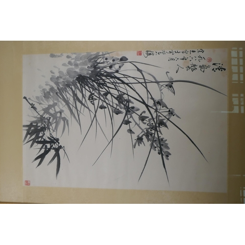 807 - A Chinese monochrome watercolour of orchids and bamboo, signed, early C20th, 44 x 67cm