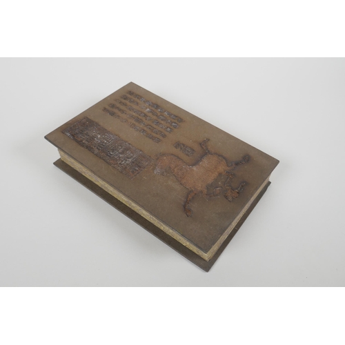 86 - A Chinese wood and silk bound book containing white jade table pages with chased and gilt inscriptio... 