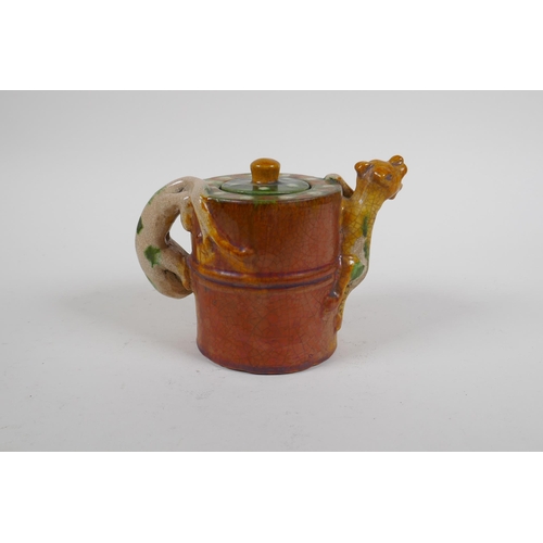 87 - A Chinese sancai crackle glazed pottery teapot with kylin handle and spout, 11cm high