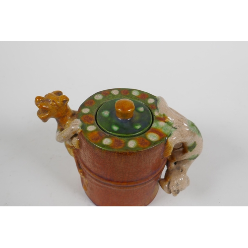 87 - A Chinese sancai crackle glazed pottery teapot with kylin handle and spout, 11cm high