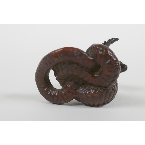 88 - A Japanese style bronze okimono cobra, seal mark to base, 4cm high