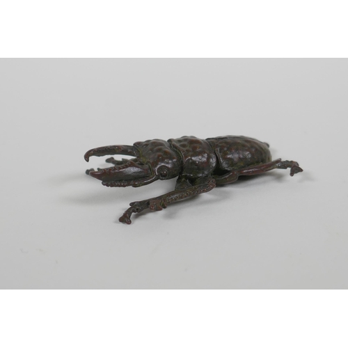 89 - A Japanese style bronze okimono stag beetle, 6cm long