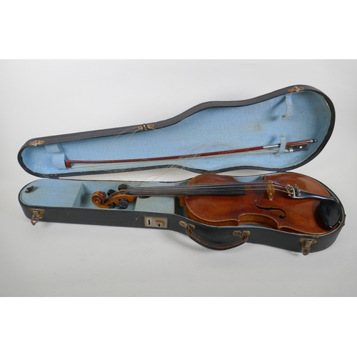 96 - A vintage violin with single piece back, stamped Stainer to the back, together with a bow and carry ... 