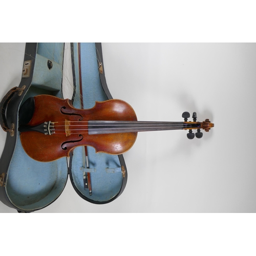 96 - A vintage violin with single piece back, stamped Stainer to the back, together with a bow and carry ... 