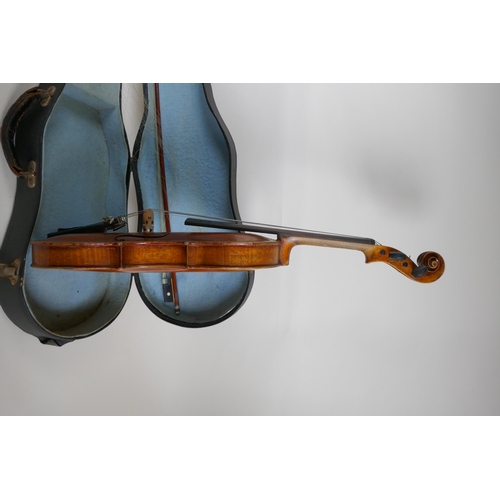 96 - A vintage violin with single piece back, stamped Stainer to the back, together with a bow and carry ... 