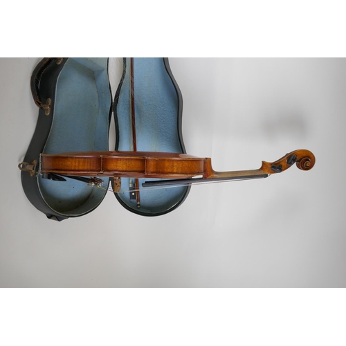 96 - A vintage violin with single piece back, stamped Stainer to the back, together with a bow and carry ... 