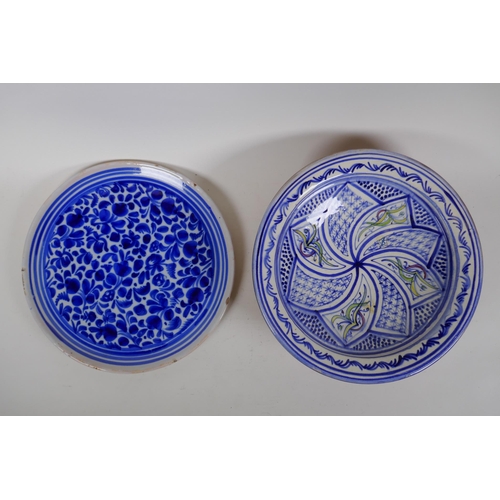 98 - An antique Continental tin glazed blue and white dish with floral decoration, together with a Contin... 