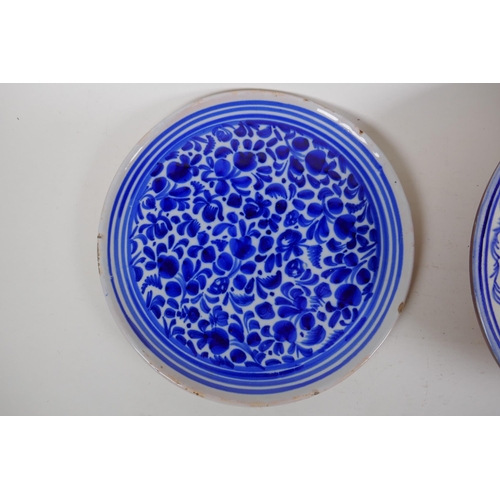 98 - An antique Continental tin glazed blue and white dish with floral decoration, together with a Contin... 