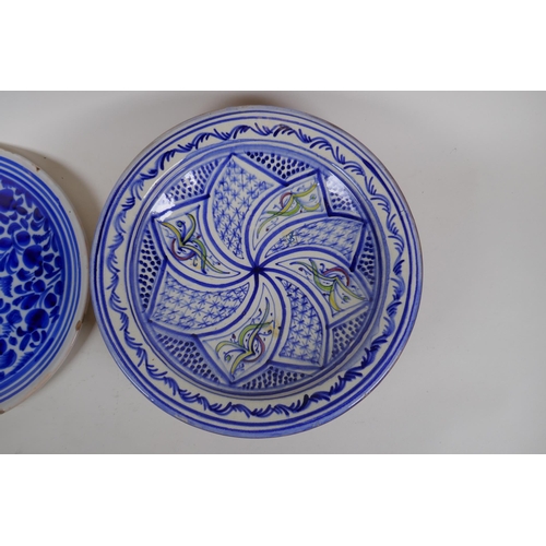 98 - An antique Continental tin glazed blue and white dish with floral decoration, together with a Contin... 