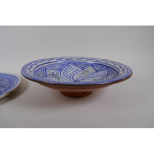 98 - An antique Continental tin glazed blue and white dish with floral decoration, together with a Contin... 