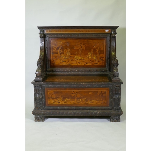 1021 - An early C19th Continental marquetry inlaid settle, the seat back and front panel decorated with hun... 