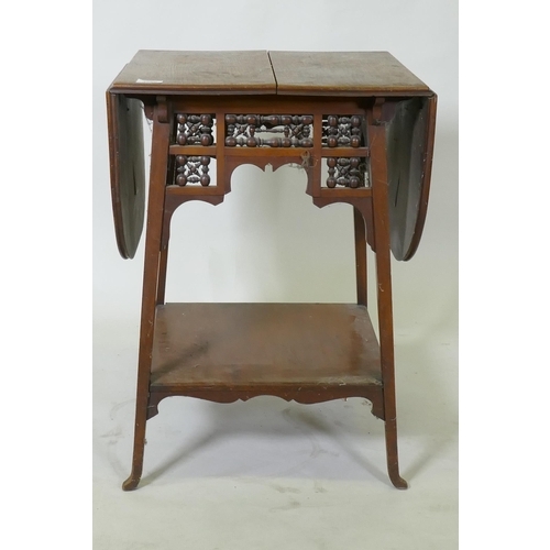 1060 - A C19th walnut Arts & Crafts Moorish style drop leaf occasional table, raised on splay supports,... 