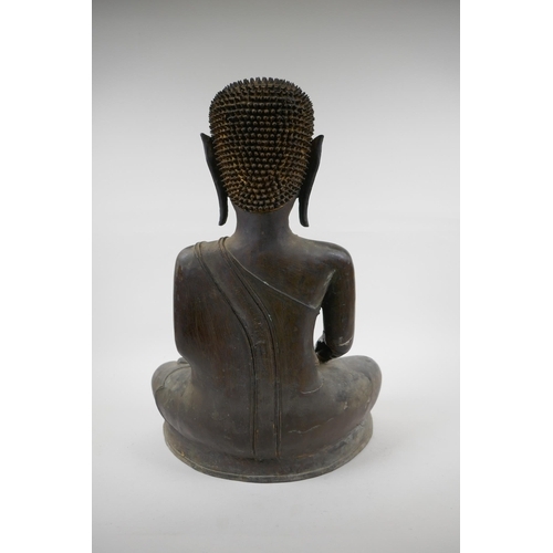 5 - An C18th (?) bronze Buddha, probably Burmese, with historic repairs, 46cm high