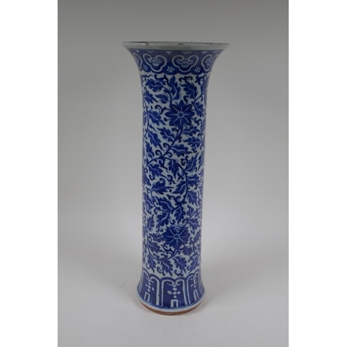 14 - A C19th Chinese blue and white porcelain cylinder vase with allover scrolling floral decoration, 46c... 