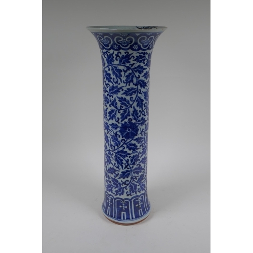 14 - A C19th Chinese blue and white porcelain cylinder vase with allover scrolling floral decoration, 46c... 