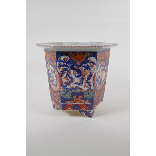 23 - A C19th Chinese Imari porcelain planter of hexagonal form, with phoenix and floral decorative panels... 