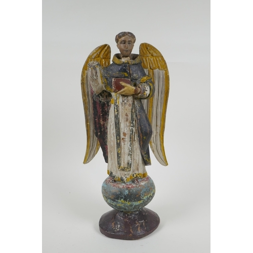 25 - A C19th carved and painted limewood figure of a saint, AF repair, 35cm high