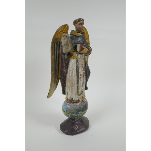 25 - A C19th carved and painted limewood figure of a saint, AF repair, 35cm high