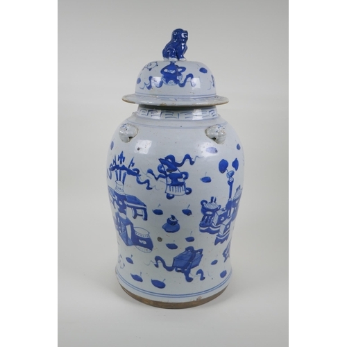 35 - An early C20th Chinese blue and white porcelain jar and cover with four lion mask handles, a Fo-dog ... 